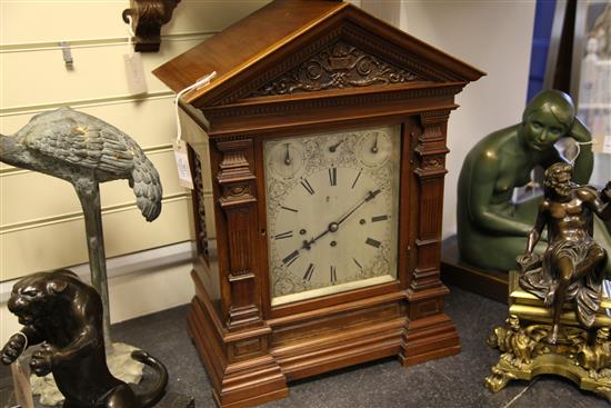 An Edwardian walnut chiming bracket clock, overall height 38in.